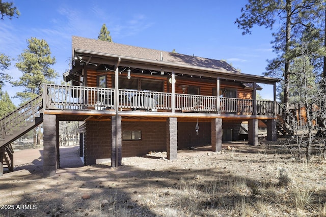 back of house featuring a deck