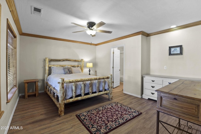 bedroom featuring dark wood-type flooring, ceiling fan, connected bathroom, and crown molding