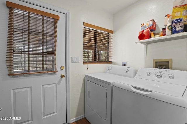 washroom featuring washing machine and clothes dryer