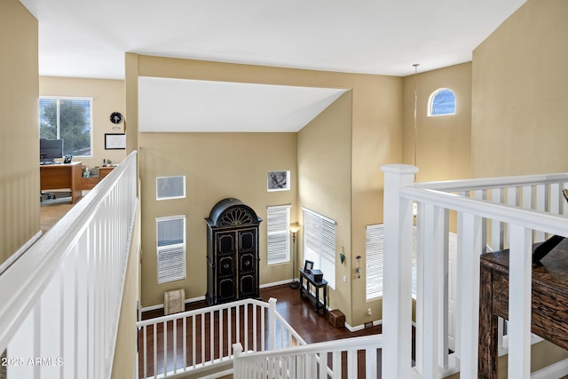 entrance foyer featuring a wealth of natural light, visible vents, dark wood-type flooring, and baseboards