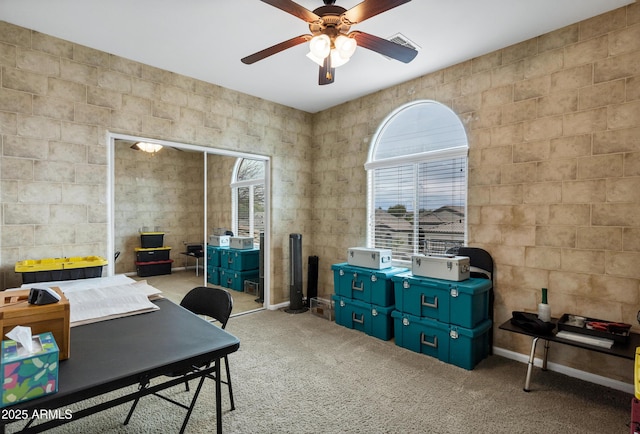 office space with carpet floors and a ceiling fan