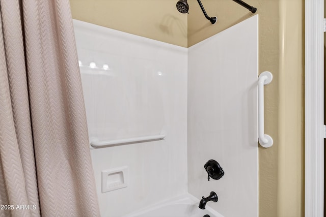 full bathroom featuring shower / bath combo with shower curtain