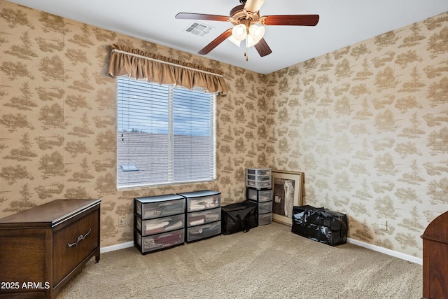 misc room with visible vents, carpet, a ceiling fan, and wallpapered walls