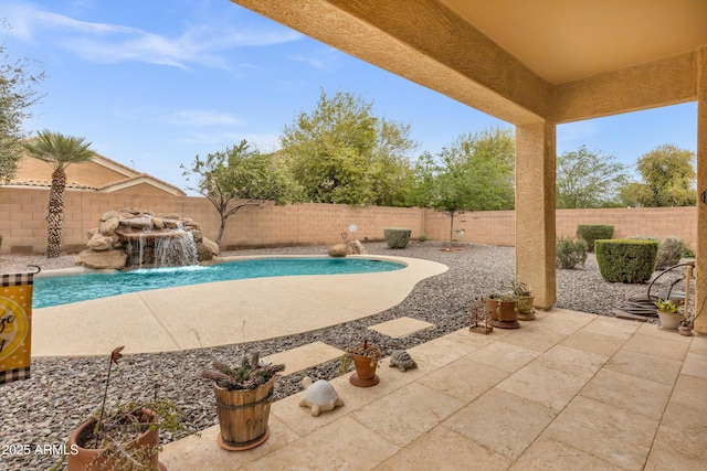 view of swimming pool with a fenced in pool, a fenced backyard, and a patio area