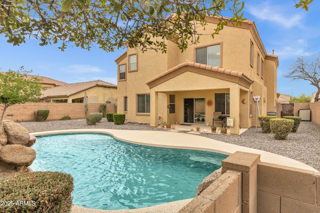 view of pool featuring a fenced in pool, a fenced backyard, and a patio area