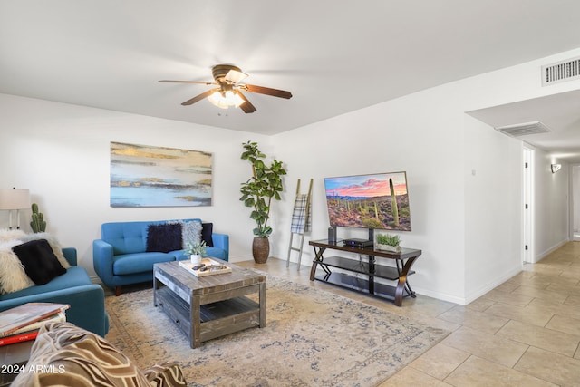 living room with ceiling fan and light tile patterned floors