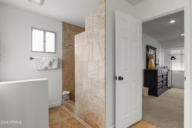 bathroom with tiled shower