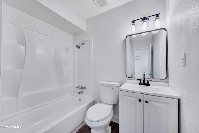 119 W Silver Reef Rd, Casa Grande, AZ 85122 - bathroom featuring toilet, vanity, bathtub / shower combination, wood finished floors, and baseboards