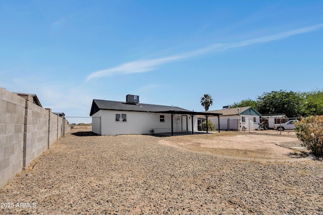 119 W Silver Reef Rd, Casa Grande, AZ 85122 - back of property with cooling unit, a fenced backyard, and a patio area