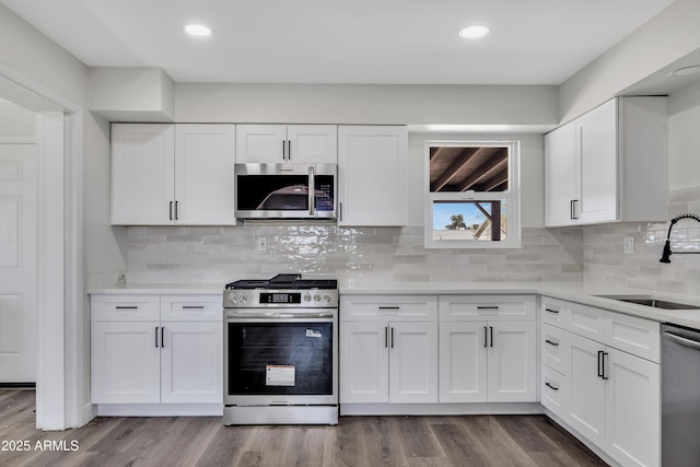 119 W Silver Reef Rd, Casa Grande, AZ 85122 - kitchen featuring appliances with stainless steel finishes, a sink, white cabinetry, light countertops, and recessed lighting