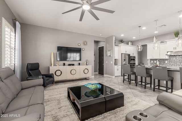 living room featuring visible vents, recessed lighting, light tile patterned floors, and a ceiling fan