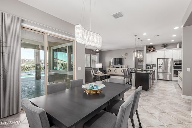 dining area with light tile patterned flooring, visible vents, ceiling fan, and recessed lighting