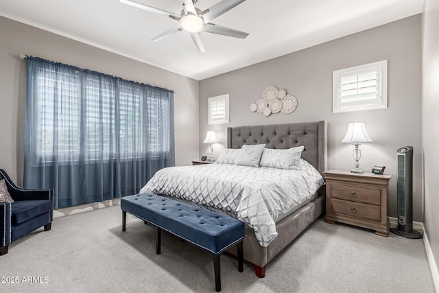 bedroom featuring light carpet and ceiling fan