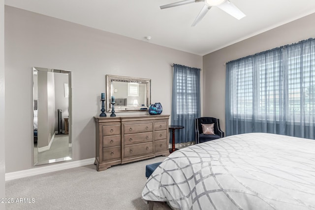 bedroom with baseboards, ceiling fan, and carpet flooring