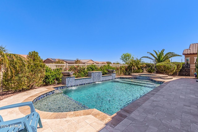 view of swimming pool with a patio, an in ground hot tub, fence, and a fenced in pool