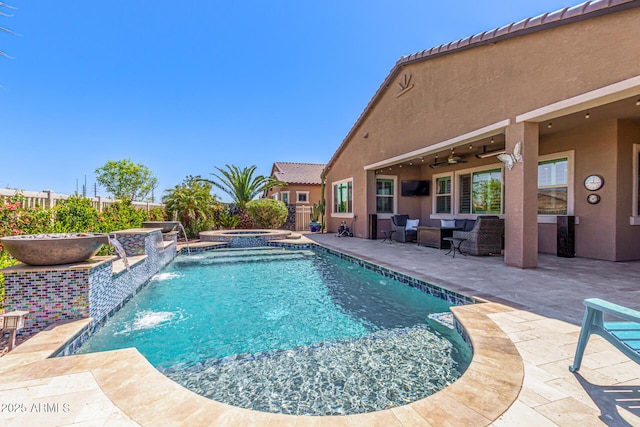 view of pool featuring an in ground hot tub, a fenced in pool, a ceiling fan, fence, and a patio