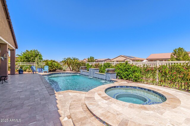 view of pool with a fenced backyard, an in ground hot tub, a patio area, and a fenced in pool
