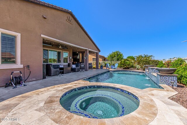 view of swimming pool with a patio, ceiling fan, a fenced in pool, and an in ground hot tub