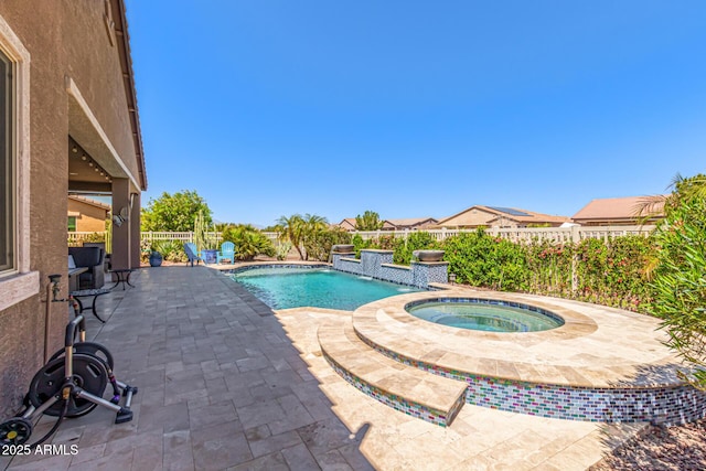 view of pool featuring a fenced backyard, a fenced in pool, an in ground hot tub, and a patio area