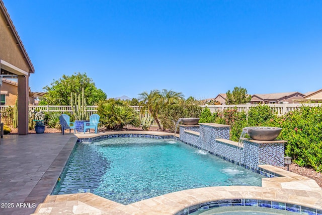 view of swimming pool with a fenced backyard, a fenced in pool, an in ground hot tub, and a patio area