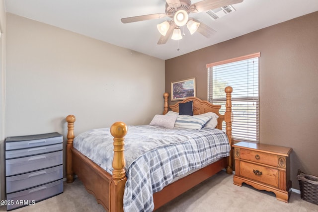 bedroom featuring visible vents, light carpet, and ceiling fan