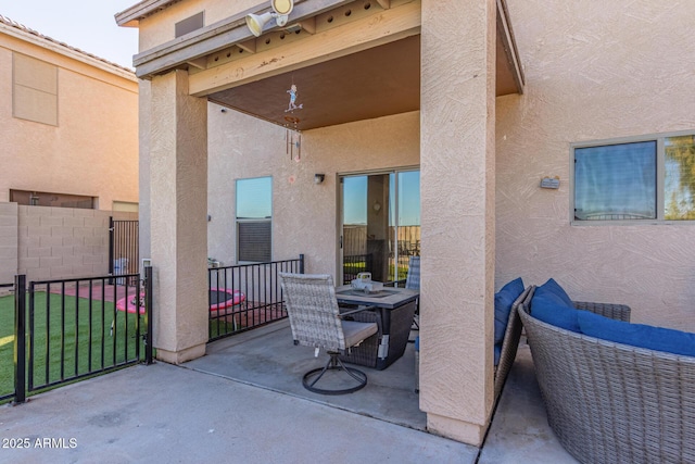 view of patio / terrace featuring fence
