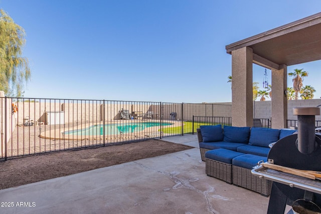 view of patio / terrace with an outdoor living space, a fenced in pool, and a fenced backyard