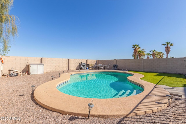 view of swimming pool featuring a patio area, a fenced in pool, and a fenced backyard