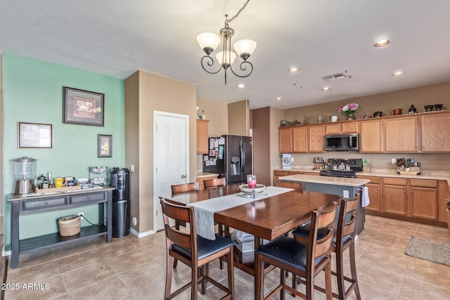 dining space with visible vents, a notable chandelier, recessed lighting, light tile patterned floors, and baseboards