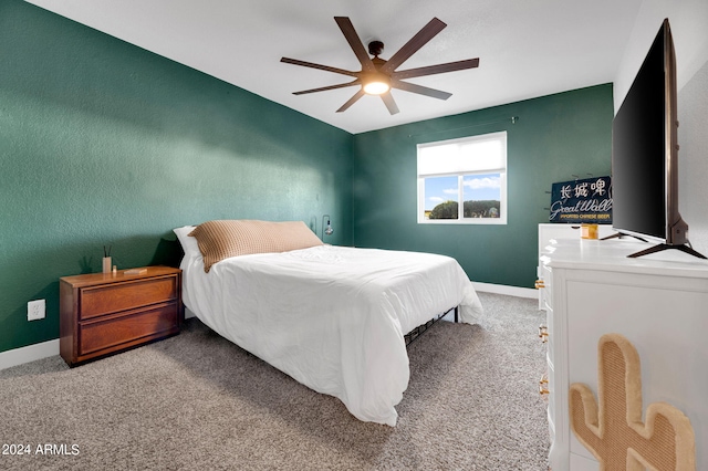 carpeted bedroom with ceiling fan