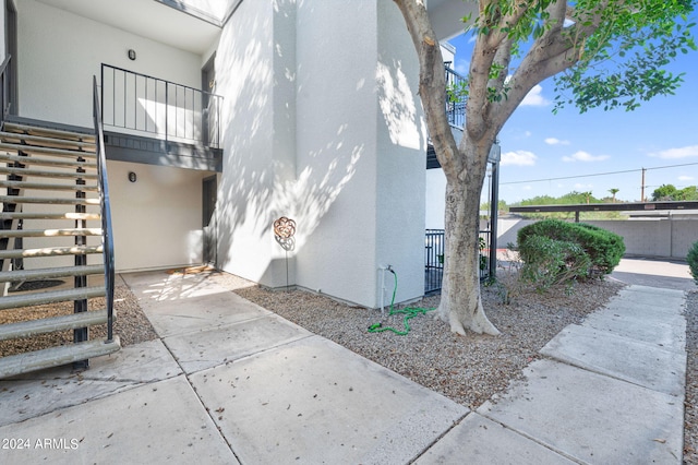 view of side of home with a patio area