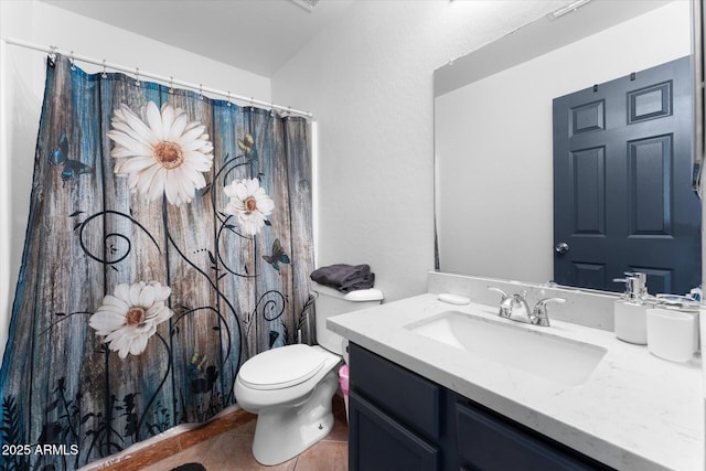 bathroom featuring a shower with shower curtain, tile patterned floors, vanity, and toilet
