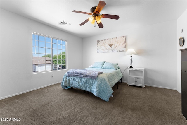 bedroom with dark colored carpet, visible vents, baseboards, and a ceiling fan