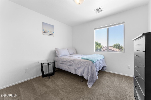 bedroom with baseboards, carpet, and visible vents