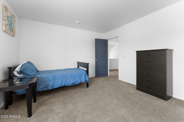 bedroom with carpet flooring and baseboards