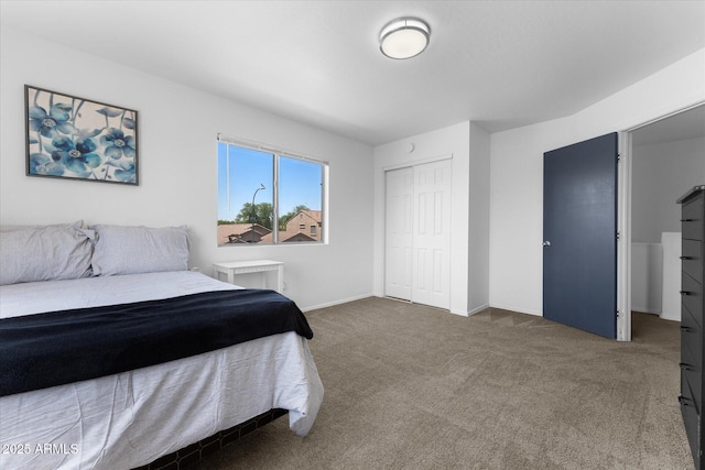 bedroom featuring carpet flooring, a closet, and baseboards
