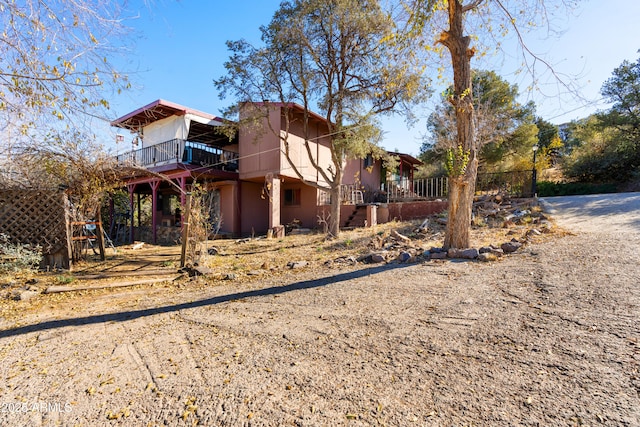 view of side of property with a wooden deck