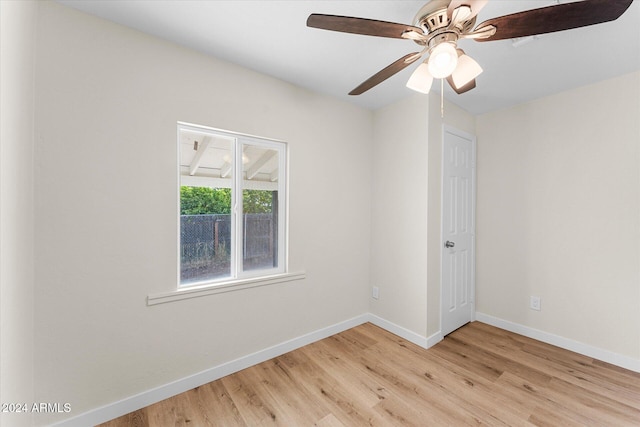 unfurnished room with ceiling fan and light wood-type flooring