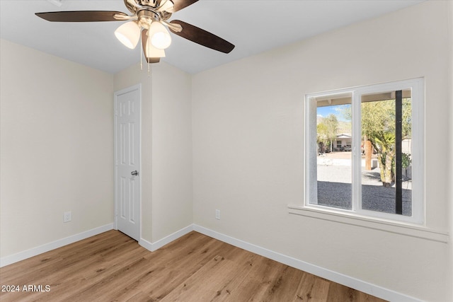 spare room with ceiling fan and light hardwood / wood-style flooring