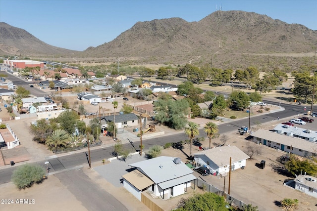 birds eye view of property with a mountain view