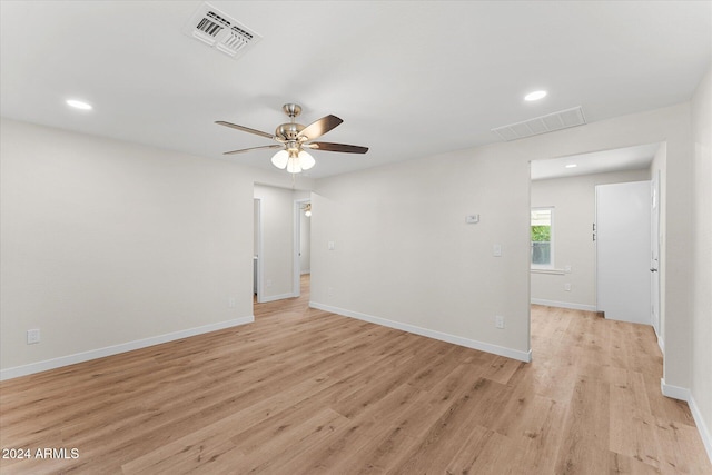 spare room with ceiling fan and light hardwood / wood-style flooring