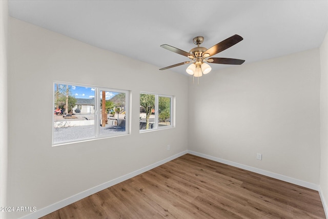 unfurnished room featuring ceiling fan and wood-type flooring