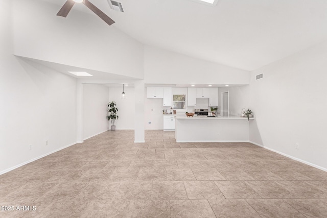 unfurnished living room featuring high vaulted ceiling and ceiling fan