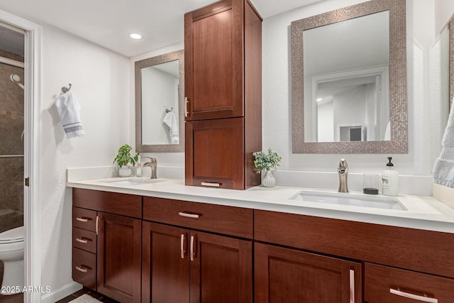 bathroom featuring vanity and toilet