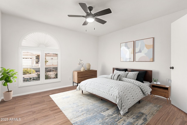 bedroom featuring wood-type flooring and ceiling fan