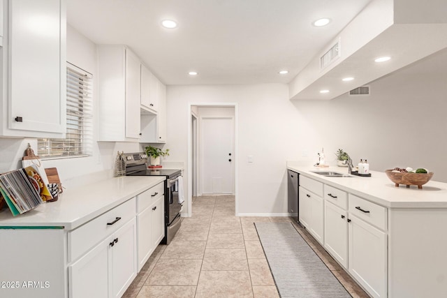 kitchen featuring white cabinetry, stainless steel appliances, sink, and light tile patterned floors