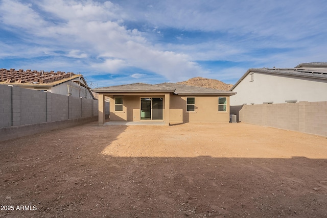 rear view of property featuring a patio