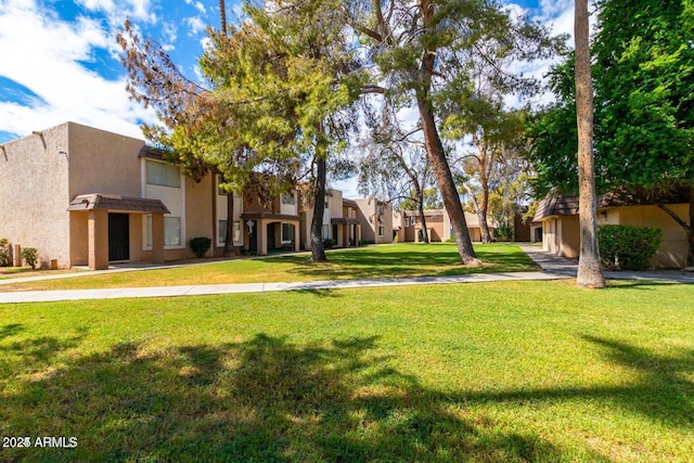 7126 N 19th Ave Unit 224, Phoenix, AZ 85021 - view of community featuring a yard