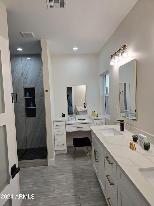 38422 W Buckeye Rd, Tonopah, AZ 85354 - full bath featuring a tile shower, recessed lighting, visible vents, and a sink