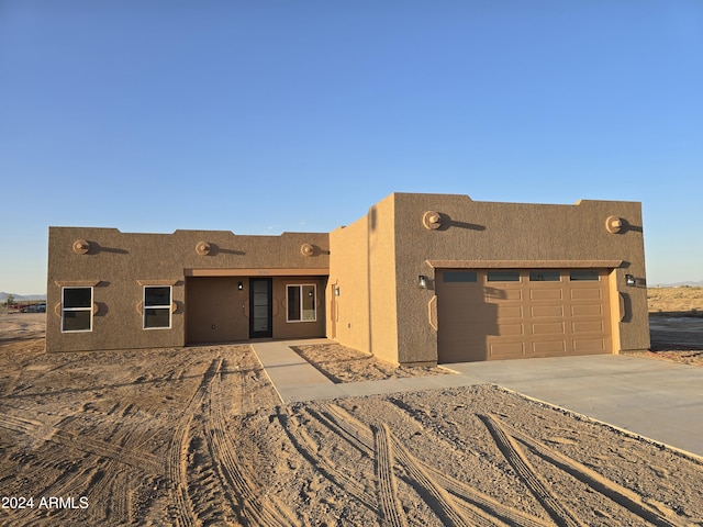 38422 W Buckeye Rd, Tonopah, AZ 85354 - southwest-style home with driveway, stucco siding, and an attached garage